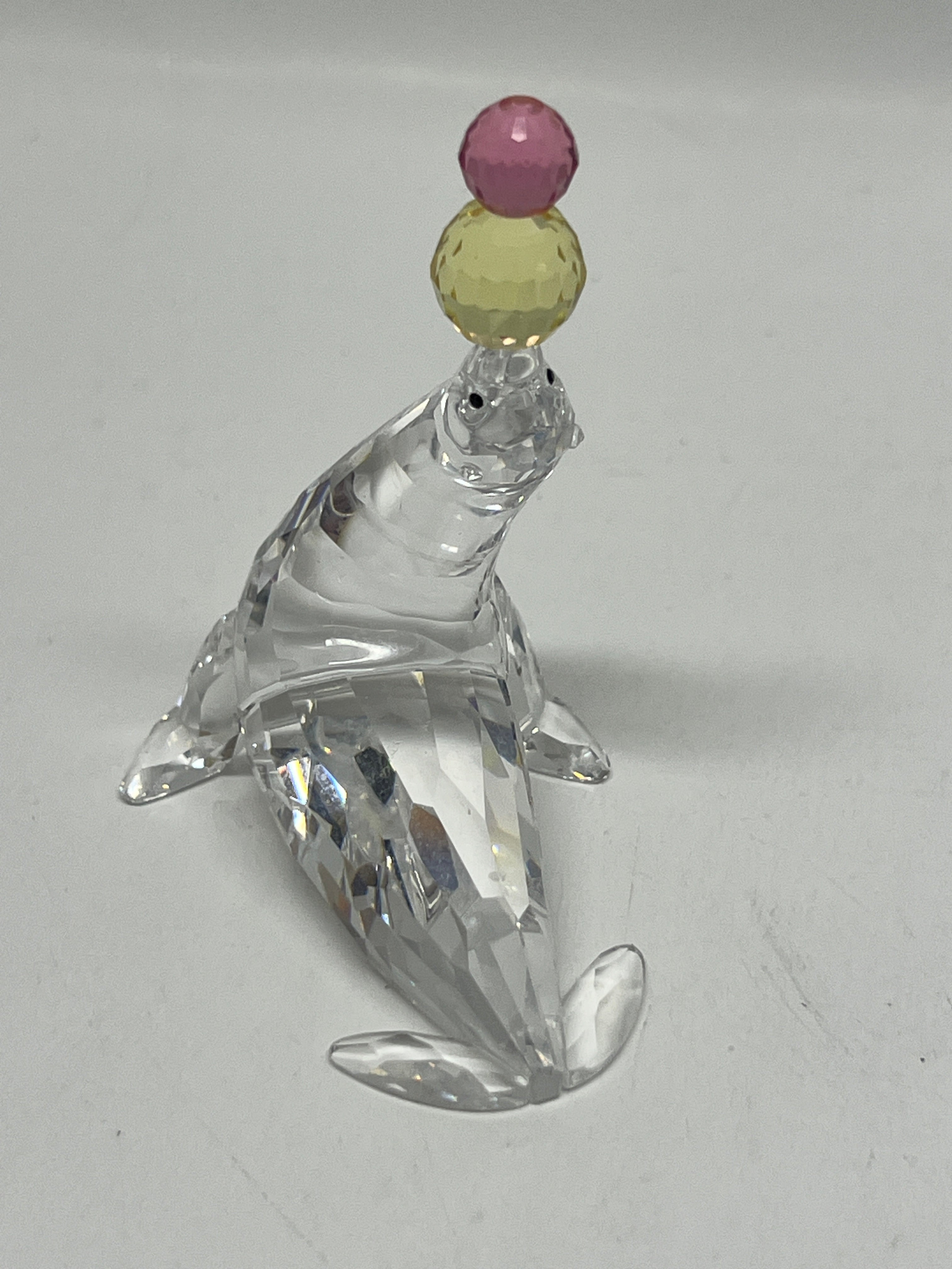 Swarovski Crystal Playing Seal with Pink and Yellow Balls #622526