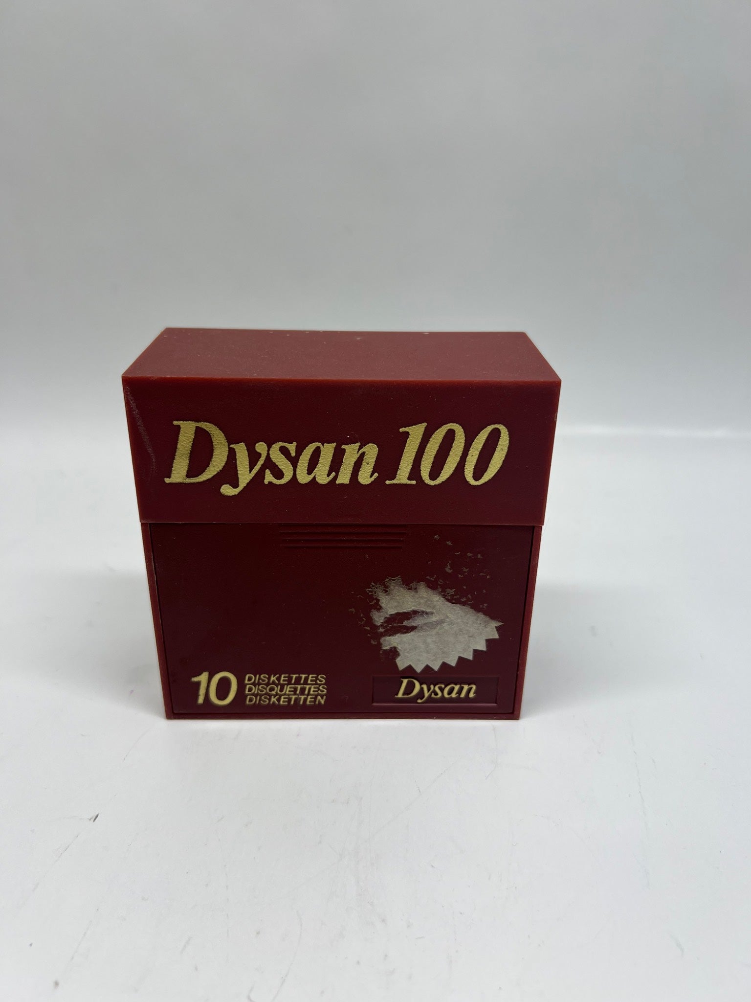 Red box of Dysan 100 dinkettes on a white background