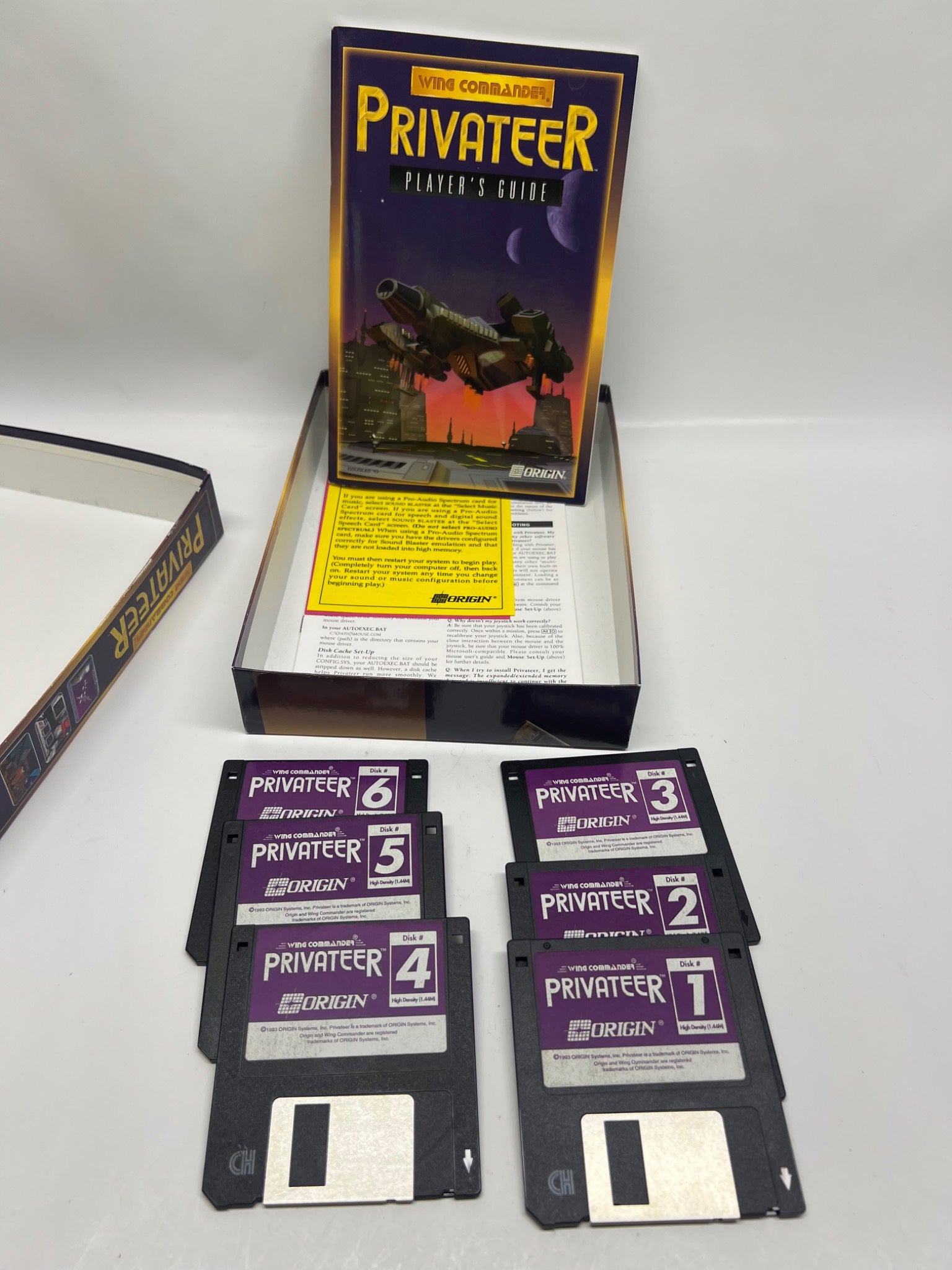 Vintage 'Privateer' computer game box with floppy disks on a white background