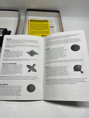 Open book with text and diagrams on a white surface