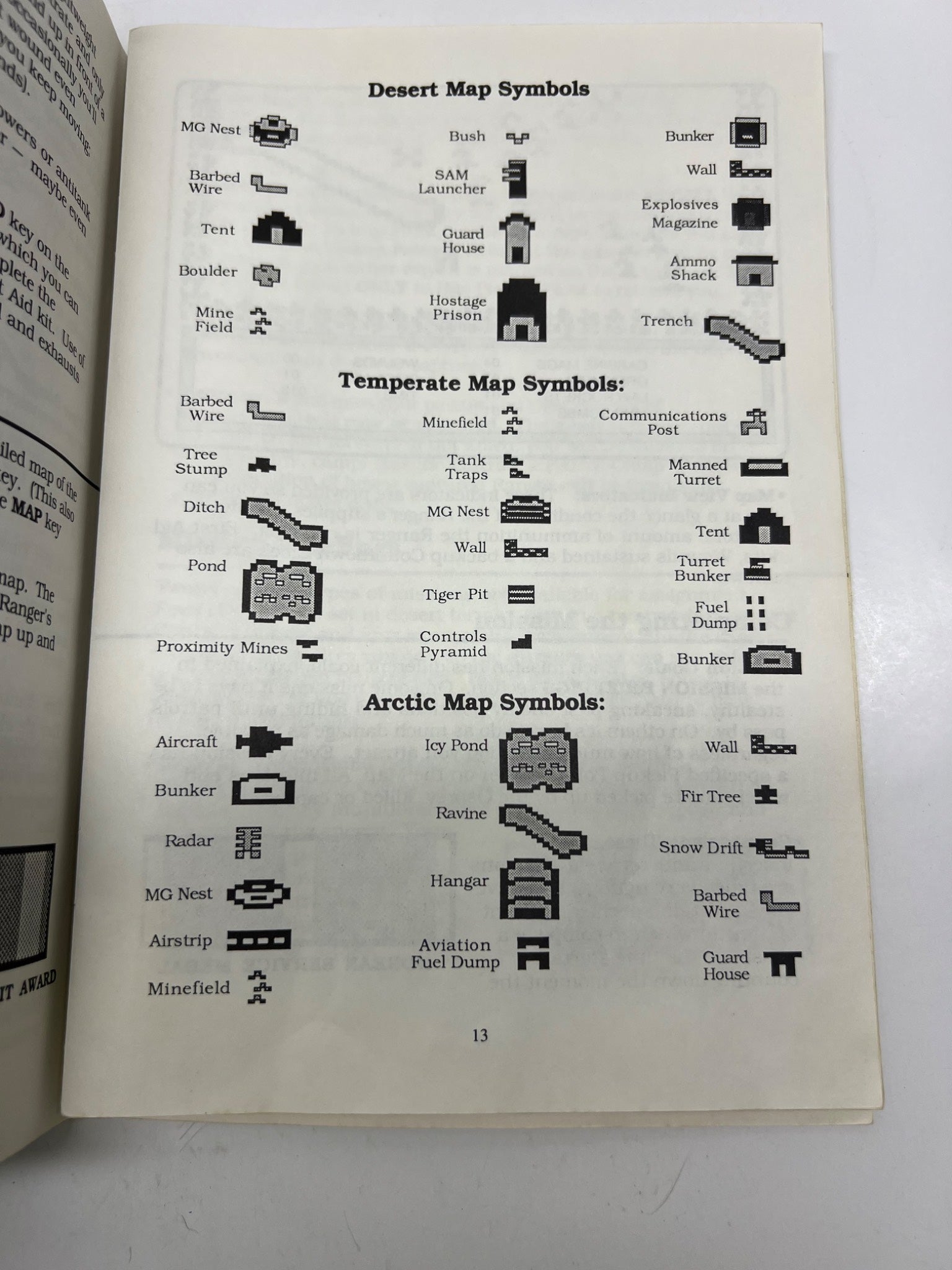 Book open to a page with map symbols for desert, temperate, and arctic regions.