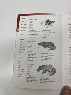 Open book with starship specifications on a white background