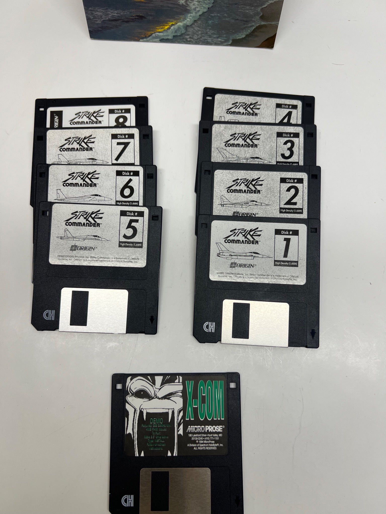Set of floppy disks with labels on a white surface