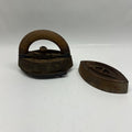 Vintage metal iron and its sole on a white background