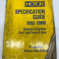 Yellow book titled 'Motor Specification Guide 1992-2000' on a white background
