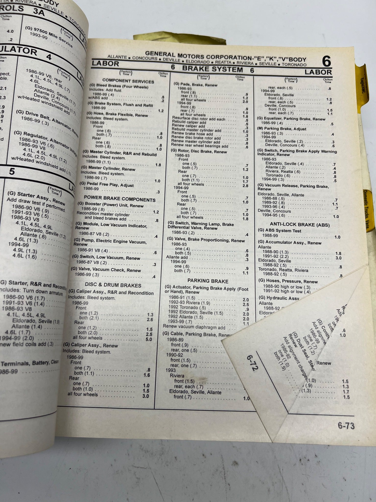 Open book with technical text and tables on a white background