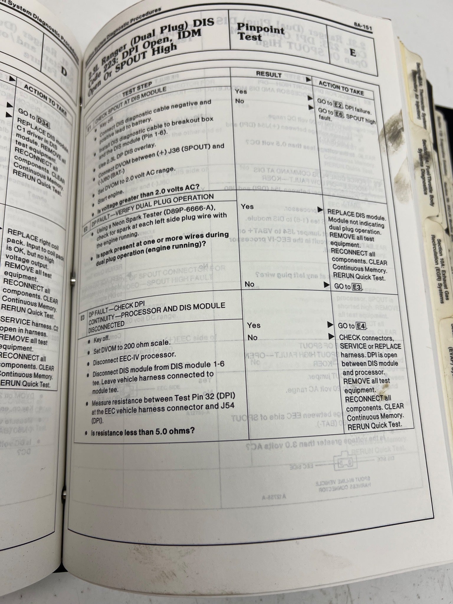 Open book with technical text and diagrams on a white background