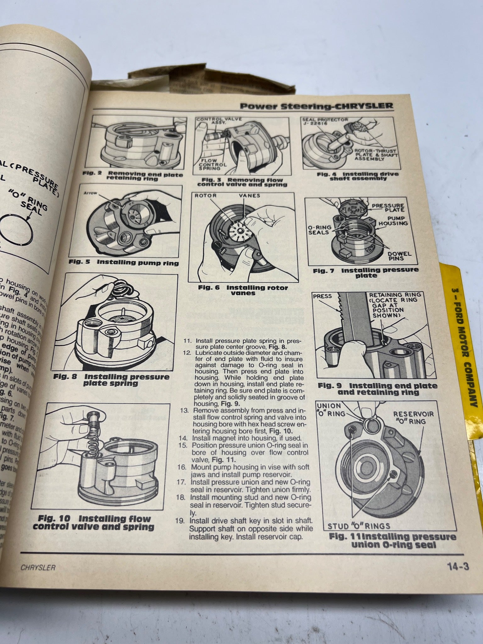 Open book with technical illustrations and text on power steering for Chrysler vehicles.