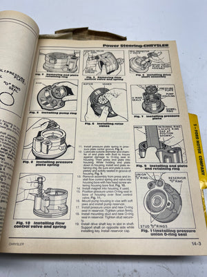 Open book with technical illustrations and text on power steering for Chrysler vehicles.
