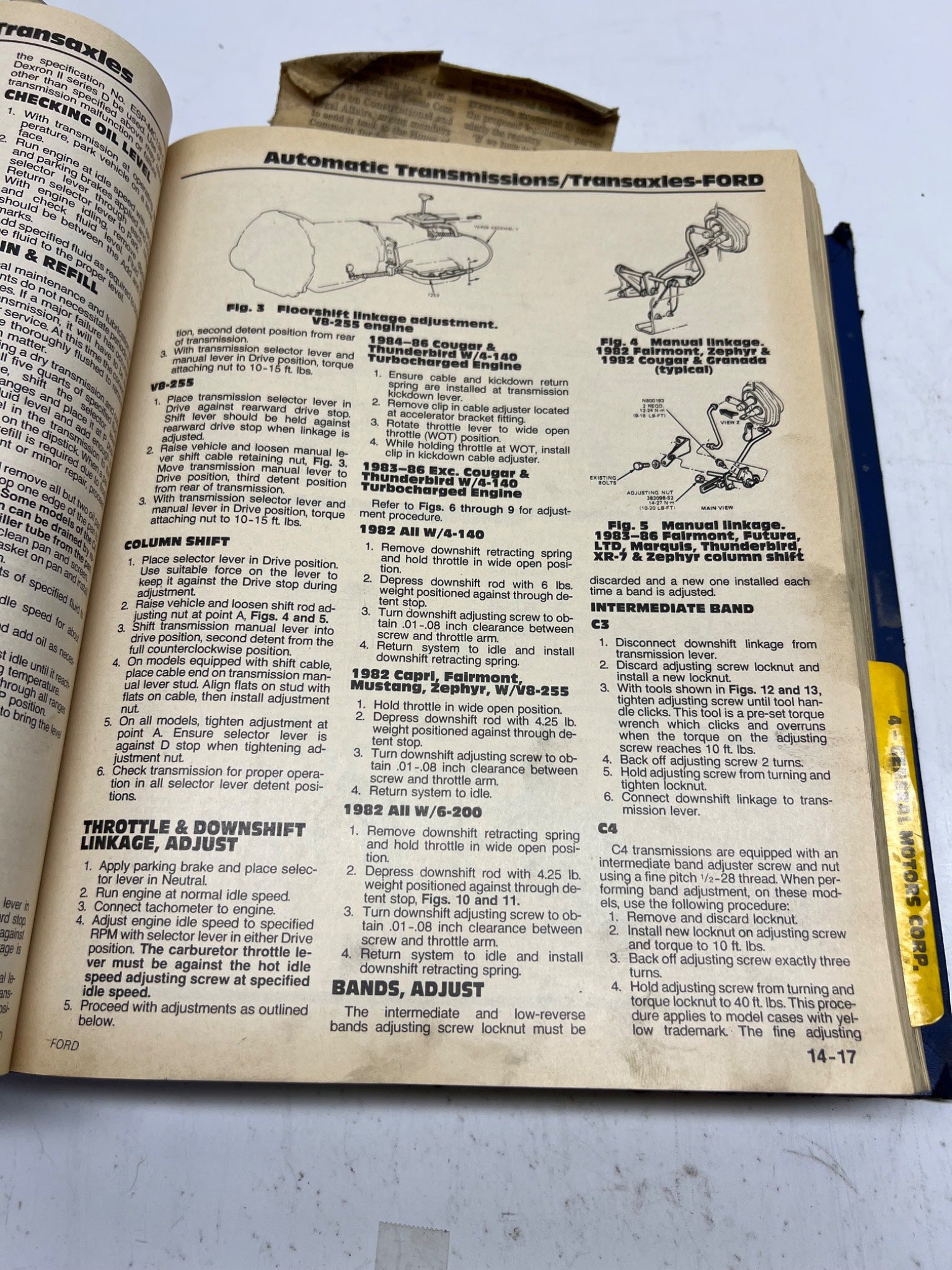 Open book with technical text and diagrams on a white background