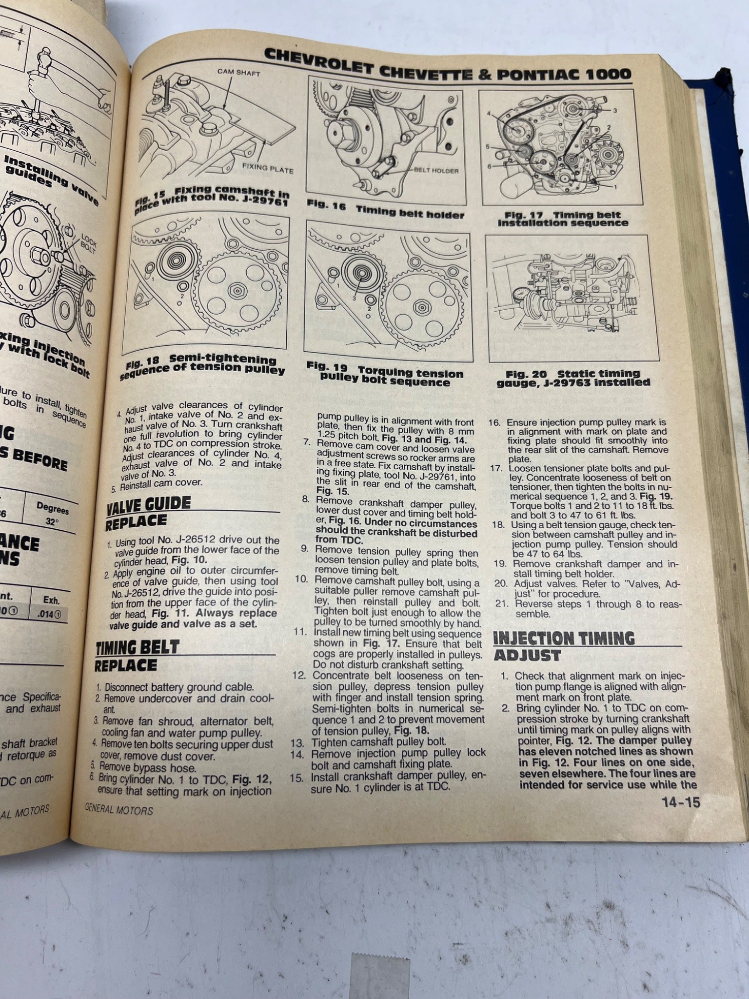 Open book with technical diagrams and text on a white background