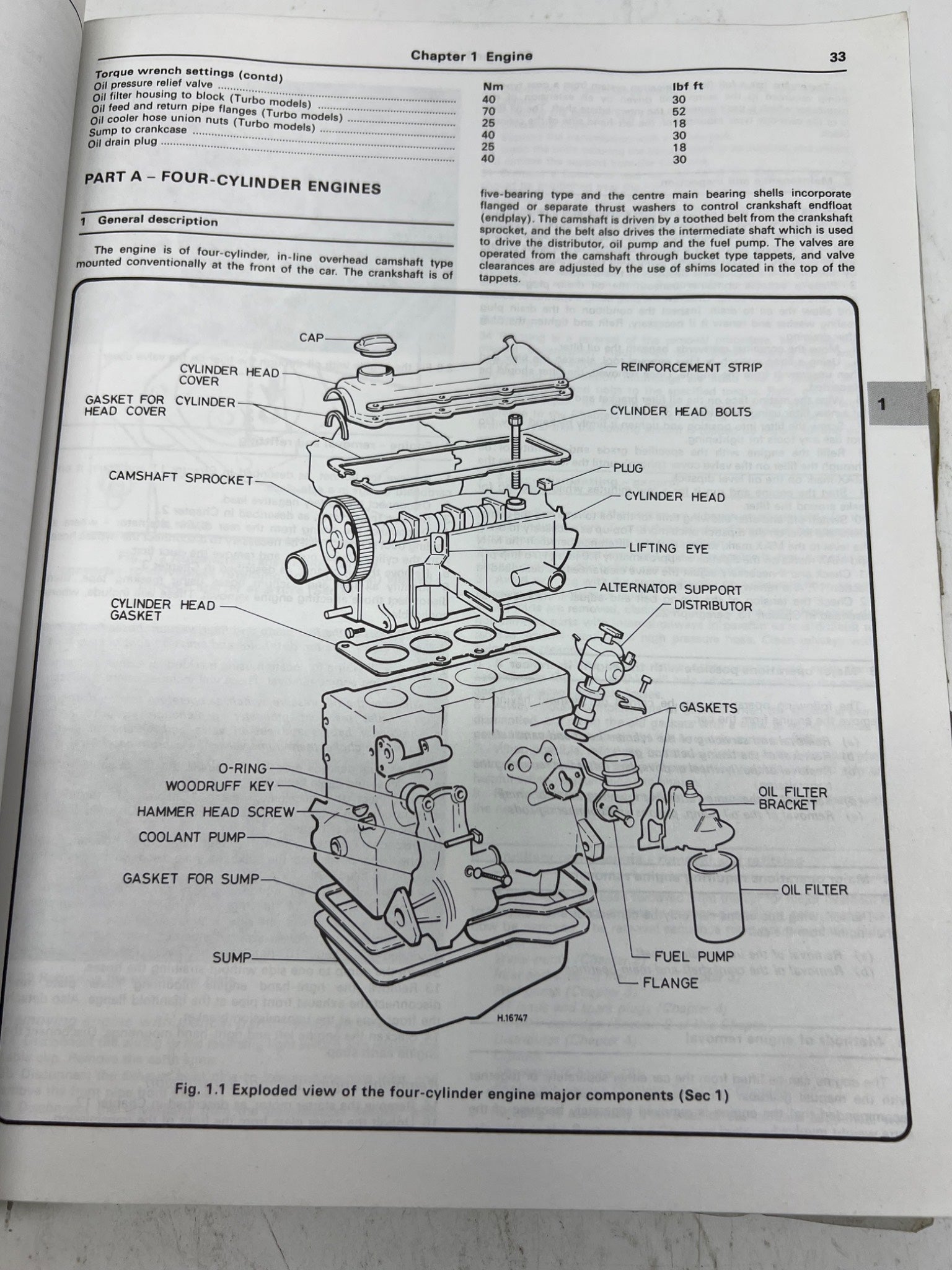 Technical diagram of a four-cylinder engine on an open book page.