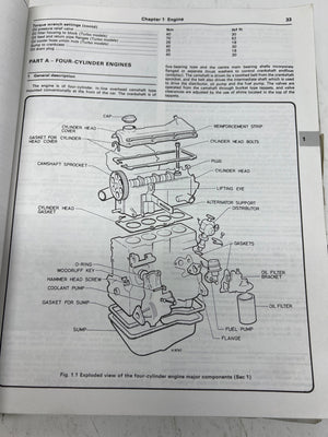 Technical diagram of a four-cylinder engine on an open book page.