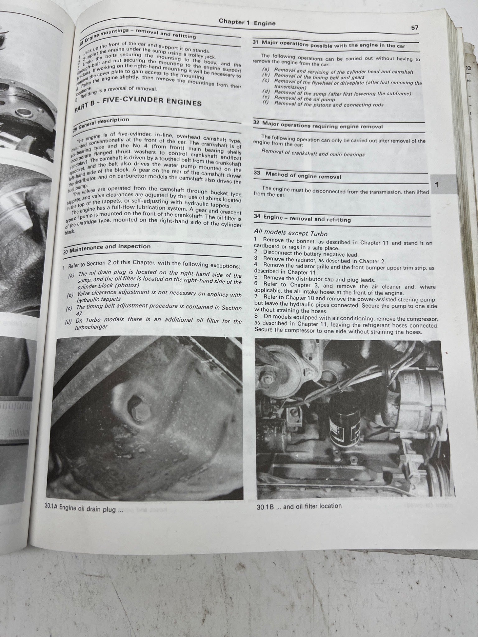 Open book with automotive repair instructions and diagrams on a white background